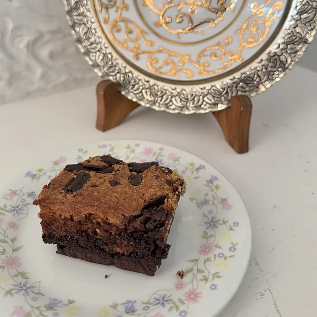 A brownie on a floral plate