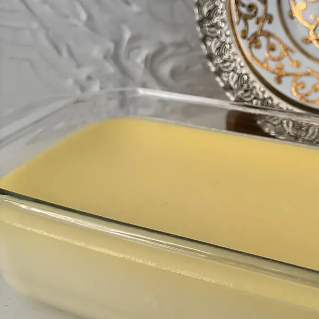 A set custard dessert in a glass dish